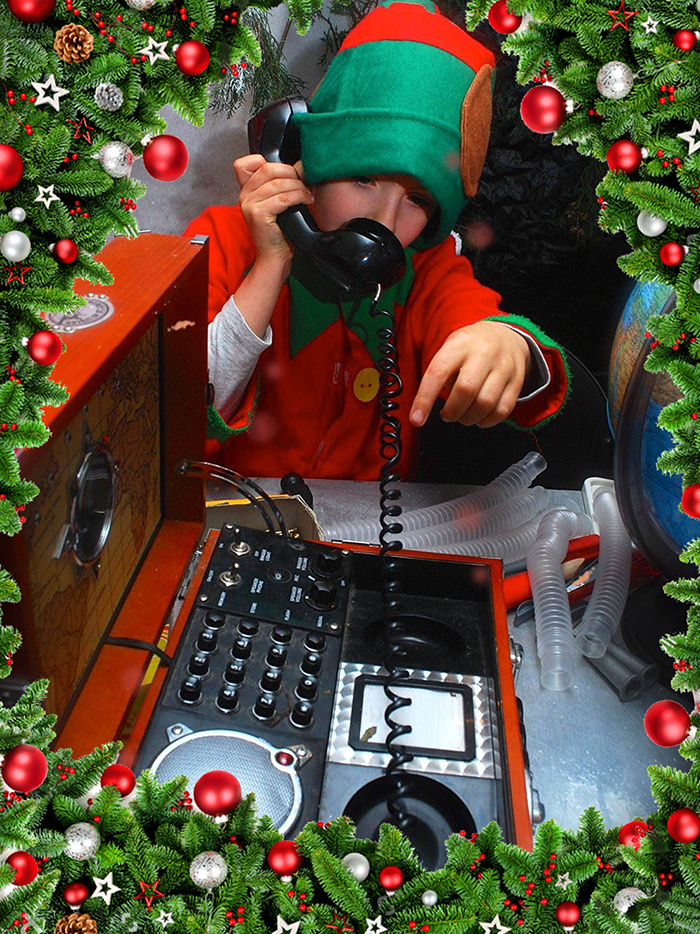 Elf talks on phone to Santa